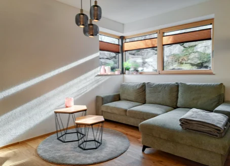 Gemütliches Wohnzimmer zum Entspannen in der Ferienwohnung Alpenglück³
